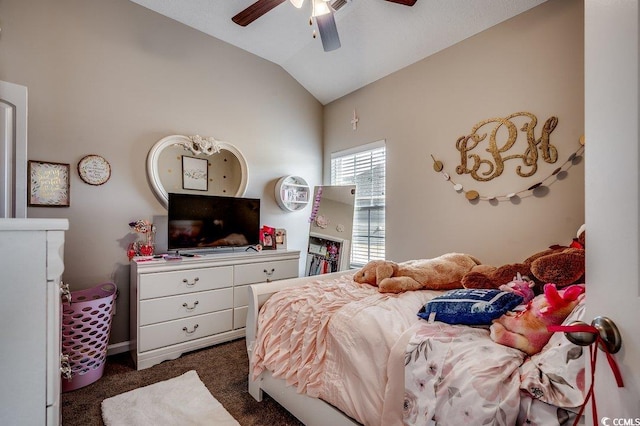 bedroom featuring dark carpet, a ceiling fan, and vaulted ceiling