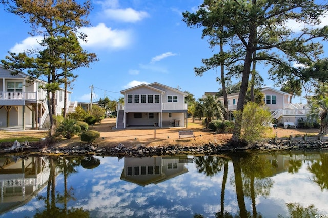 rear view of house with a water view