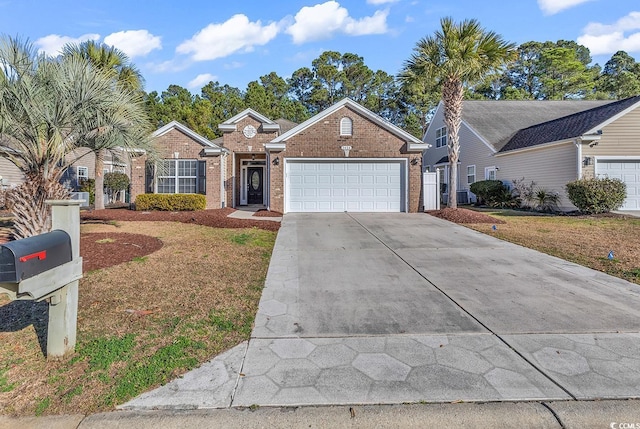 view of front of home featuring driveway, brick siding, a front lawn, and an attached garage