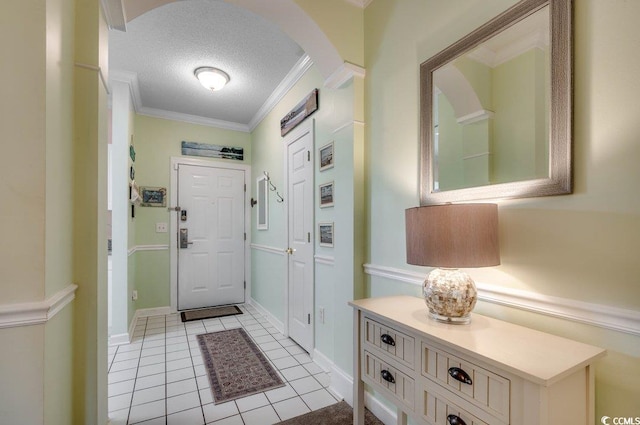 5750 Oyster Catcher Dr Unit 522, North Myrtle Beach, SC 29582 - entryway with arched walkways, a textured ceiling, light tile patterned floors, and ornamental molding