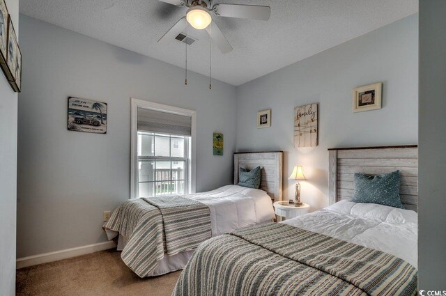 5750 Oyster Catcher Dr Unit 522, North Myrtle Beach, SC 29582 - bedroom featuring carpet and ceiling fan