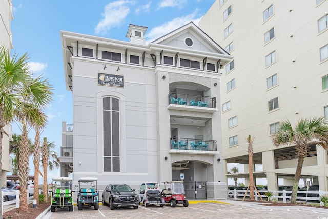 5750 Oyster Catcher Dr Unit 522, North Myrtle Beach, SC 29582 - view of building exterior with uncovered parking