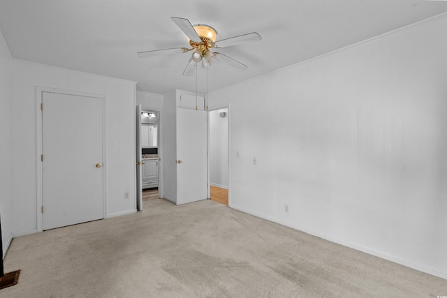 unfurnished bedroom featuring ensuite bathroom, ceiling fan, and carpet flooring