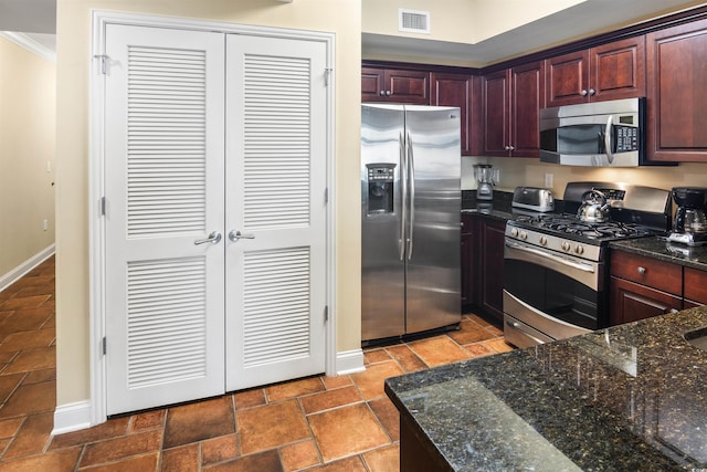 100 N Beach Blvd Unit 1917, North Myrtle Beach, SC 29582 - kitchen featuring stainless steel appliances, baseboards, crown molding, dark stone counters, and dark brown cabinets