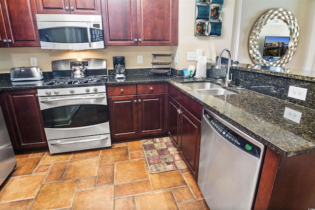 100 N Beach Blvd Unit 1917, North Myrtle Beach, SC 29582 - kitchen featuring appliances with stainless steel finishes, a sink, reddish brown cabinets, and a peninsula