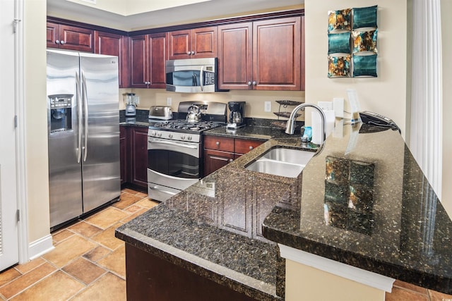 100 N Beach Blvd Unit 1917, North Myrtle Beach, SC 29582 - kitchen with appliances with stainless steel finishes, a sink, dark brown cabinets, stone tile floors, and a peninsula