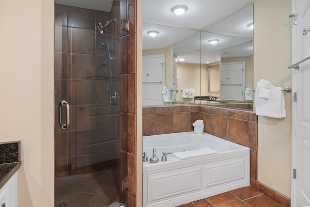 100 N Beach Blvd Unit 1917, North Myrtle Beach, SC 29582 - bathroom featuring a stall shower, a garden tub, vanity, and tile patterned flooring