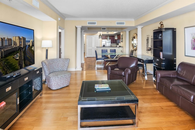 100 N Beach Blvd Unit 1917, North Myrtle Beach, SC 29582 - living room with ornate columns, light wood finished floors, ornamental molding, and baseboards
