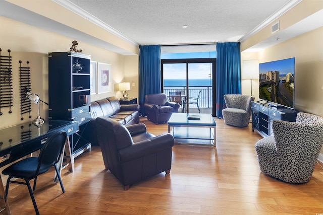 100 N Beach Blvd Unit 1917, North Myrtle Beach, SC 29582 - living area with crown molding, a textured ceiling, wood finished floors, and a wall of windows