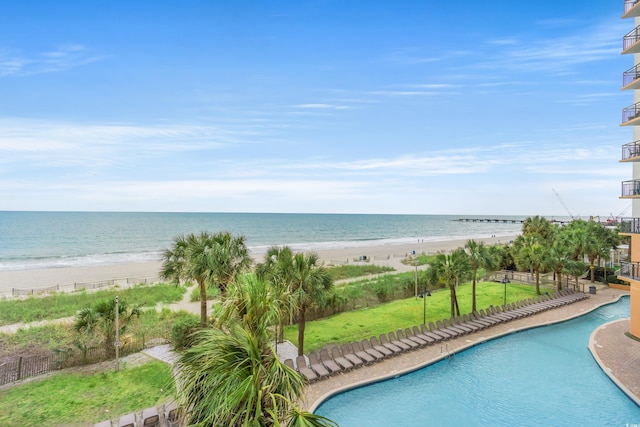 community pool with a beach view and a water view