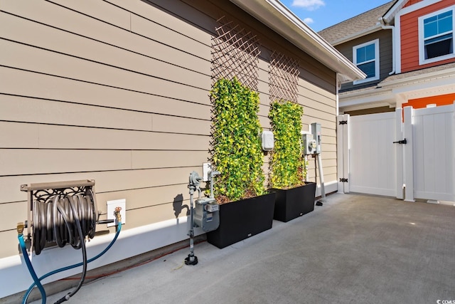 view of patio featuring a gate and fence