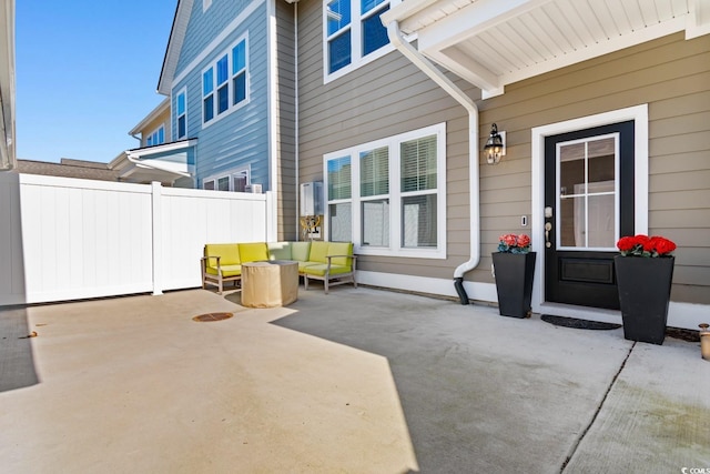 view of patio with fence and an outdoor hangout area