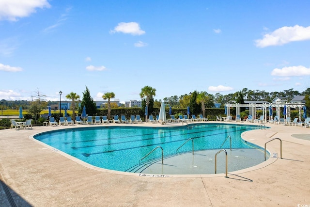 community pool featuring a patio area and a pergola