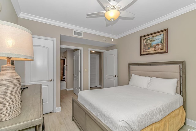 bedroom with ornamental molding, visible vents, light wood-style flooring, and baseboards