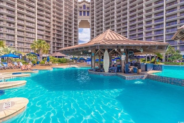 pool with a patio area