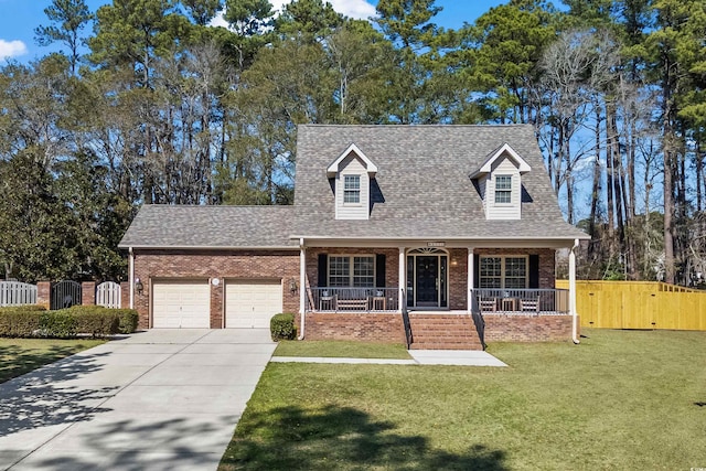 cape cod home with a garage, a shingled roof, covered porch, a gate, and brick siding