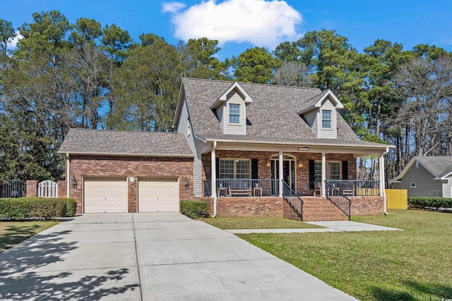 cape cod home with covered porch, brick siding, an attached garage, and a front lawn