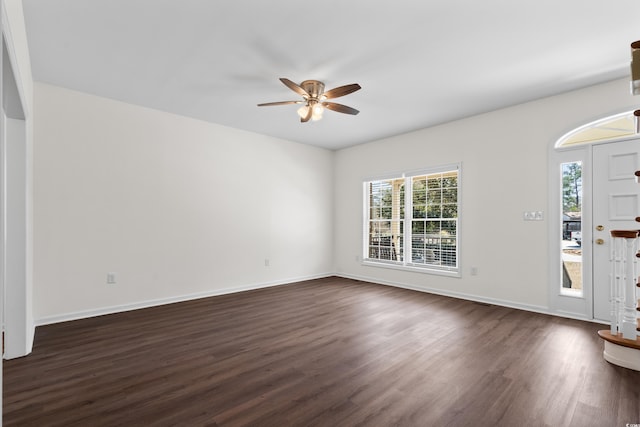 entryway with dark wood-style flooring, ceiling fan, and baseboards