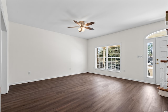 entrance foyer featuring ceiling fan, baseboards, and dark wood-style floors