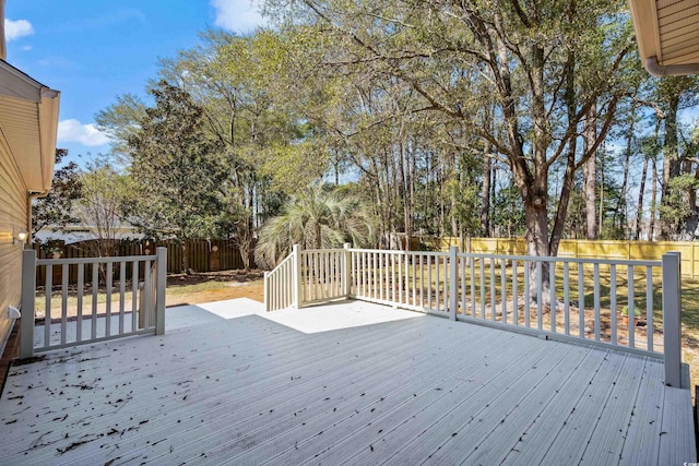 deck with a fenced backyard