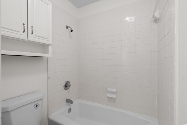 bathroom featuring toilet and shower / bathtub combination