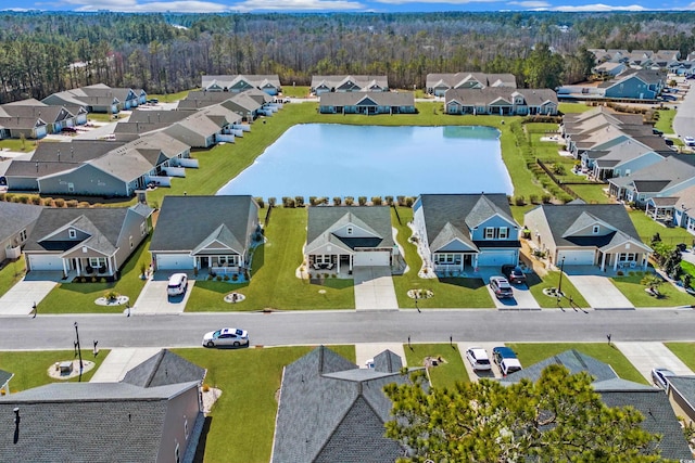 bird's eye view featuring a water view and a residential view