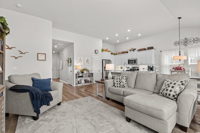 living room with recessed lighting and light wood-style flooring