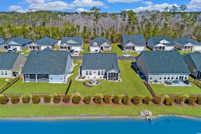 aerial view with a forest view and a residential view