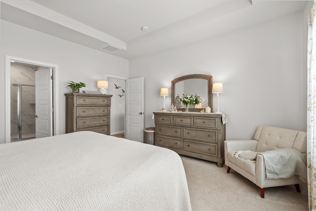 bedroom featuring a tray ceiling, visible vents, and light colored carpet