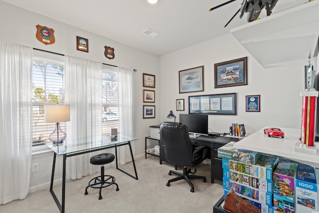 office space with carpet floors, visible vents, and baseboards