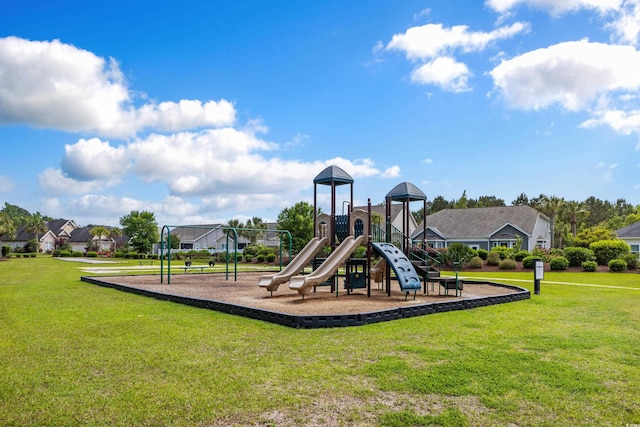 community jungle gym featuring a lawn