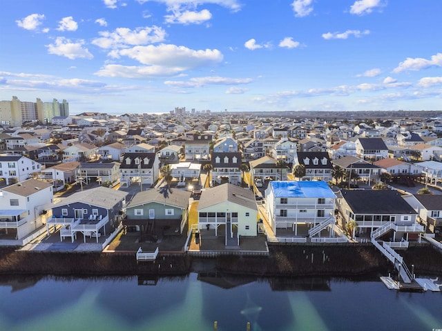 birds eye view of property featuring a residential view and a water view