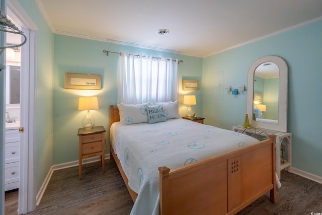 bedroom with dark wood-type flooring, visible vents, and crown molding