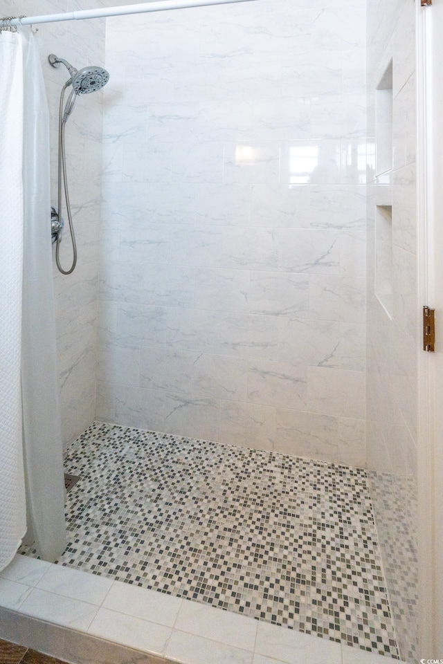 bathroom featuring a shower stall