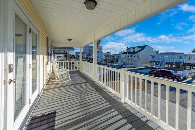 balcony featuring a porch and a residential view