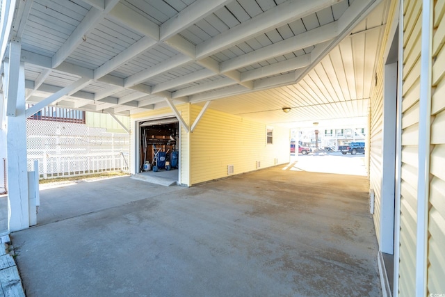 garage featuring an attached carport