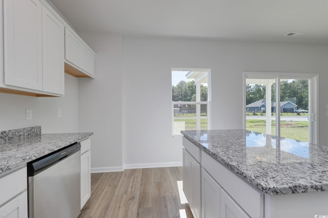 491 Wagner Cir, Conway, SC 29526 - kitchen with dishwasher, light wood-type flooring, plenty of natural light, and white cabinetry