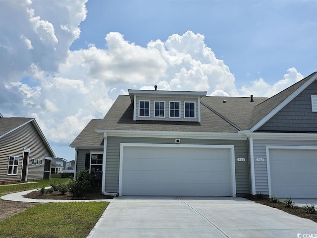 view of front of home featuring a garage and concrete driveway