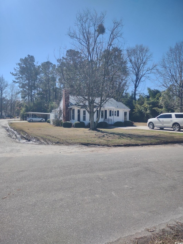 view of front of house with a chimney