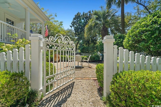 view of gate with fence