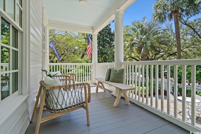 wooden terrace with ceiling fan