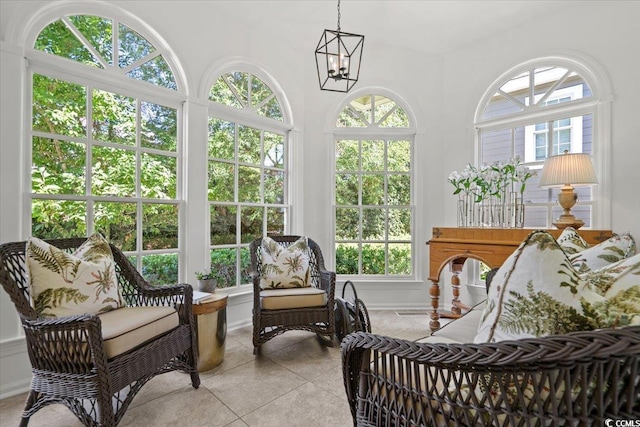 sunroom with an inviting chandelier