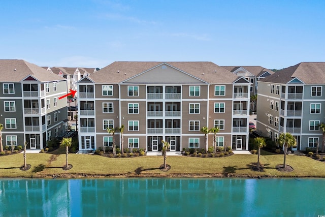 exterior space with a water view and a residential view