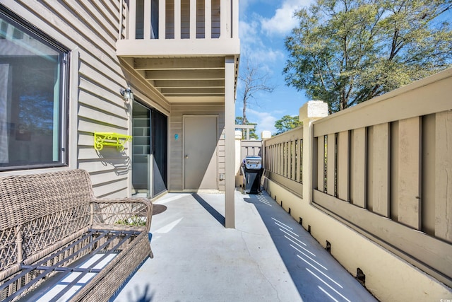 view of patio featuring fence