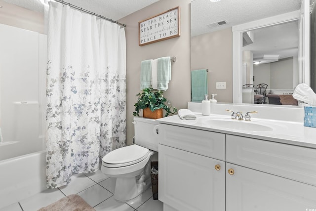 full bathroom with visible vents, toilet, tile patterned floors, a textured ceiling, and vanity