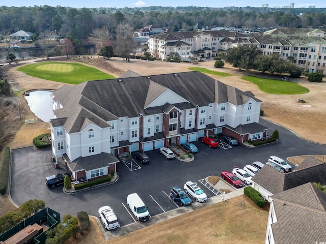 aerial view with view of golf course and a residential view