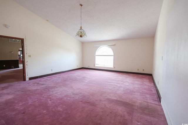 carpeted spare room with lofted ceiling, a textured ceiling, a chandelier, and baseboards