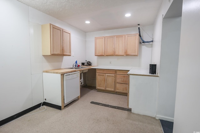 kitchen with recessed lighting, dishwasher, baseboards, and light brown cabinetry