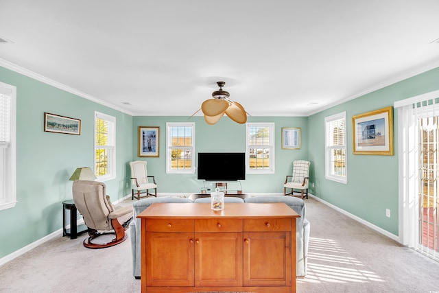 office area with ornamental molding, light colored carpet, plenty of natural light, and baseboards