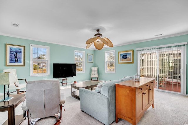 living room featuring light carpet, visible vents, and crown molding